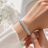 Bracelet tennis serti clos taille émeraude